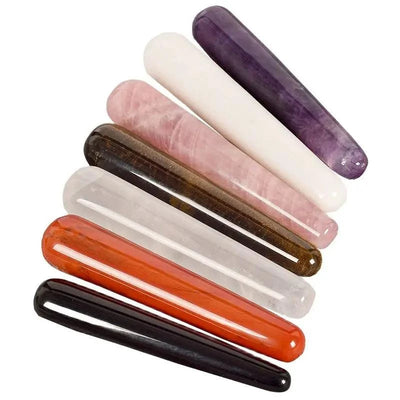 Rose quartz and crystal stone massage sticks for face and body care.