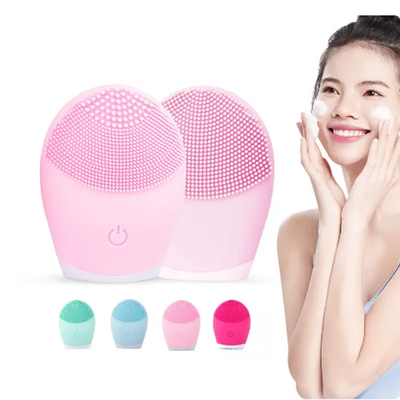 Electric silicone facial cleanser massager in pink, green, and blue colors for skincare.